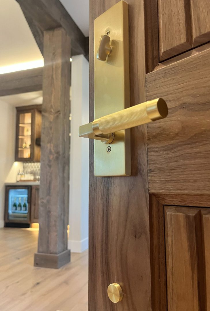 Emtek Select Modern Knurled Hercules Leverset in satin brass finish installed on a contemporary Blackwell Homes interior door, featuring a textured knurled grip for added style and a bold, modern look.