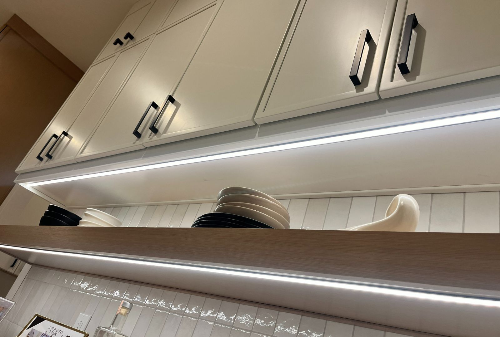 Under-cabinet lighting solutions, including LED strips, puck lights, and hardwired options, designed for illuminating kitchen countertops and workspaces, available on hardwarehut.com