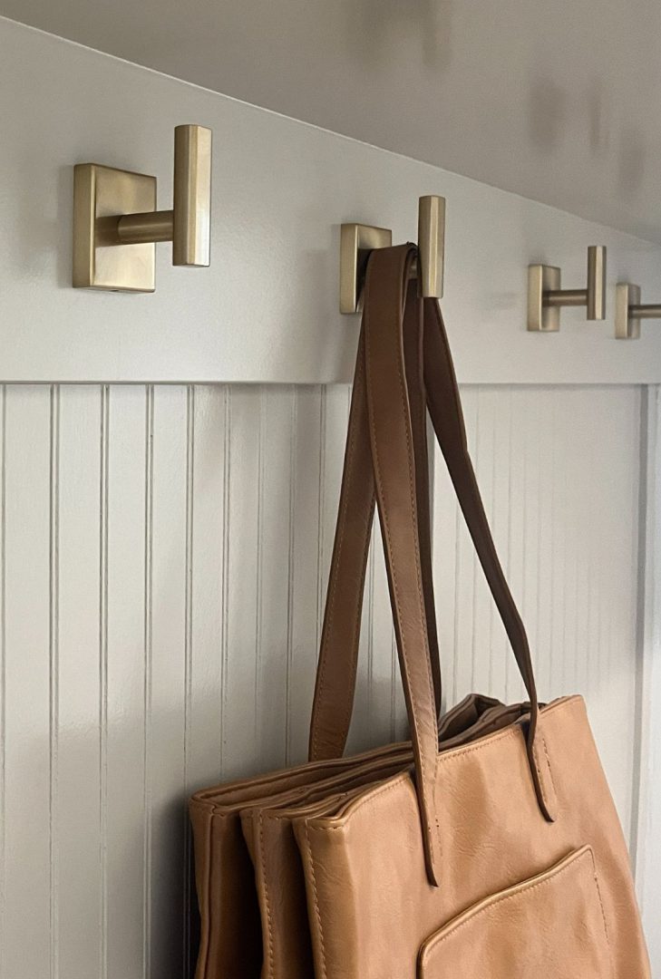 Decorative and functional hooks for home organization, including wall hooks, coat hooks, and utility hooks in various finishes and designs, available on hardwarehut.com