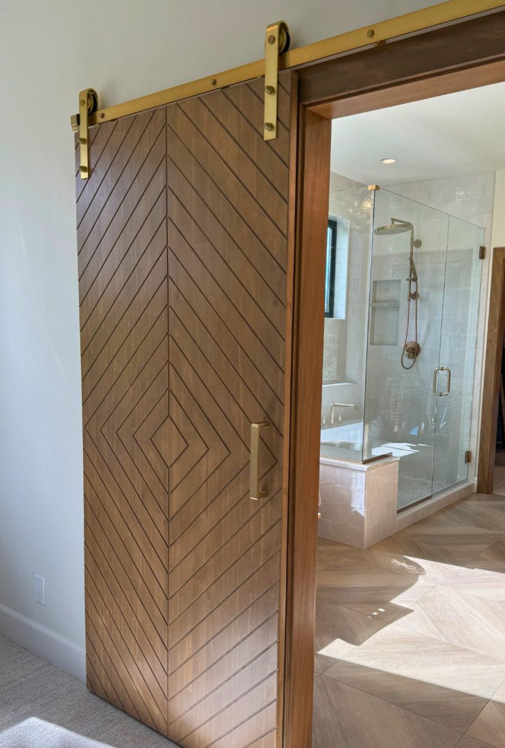 Sure-Loc rolling barn door track system featuring smooth-gliding hardware for sliding barn doors, available in various finishes, ideal for adding rustic or modern style to interior spaces.