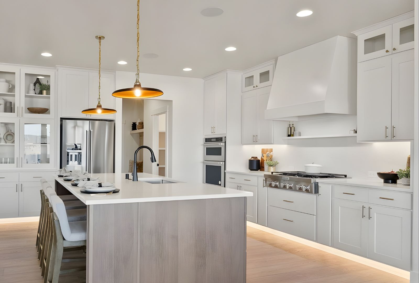 Modern kitchen featuring sleek cabinetry hardware from Hardware Hut, including brushed nickel cabinet pulls, under-cabinet lighting, and an organized pullout storage system.