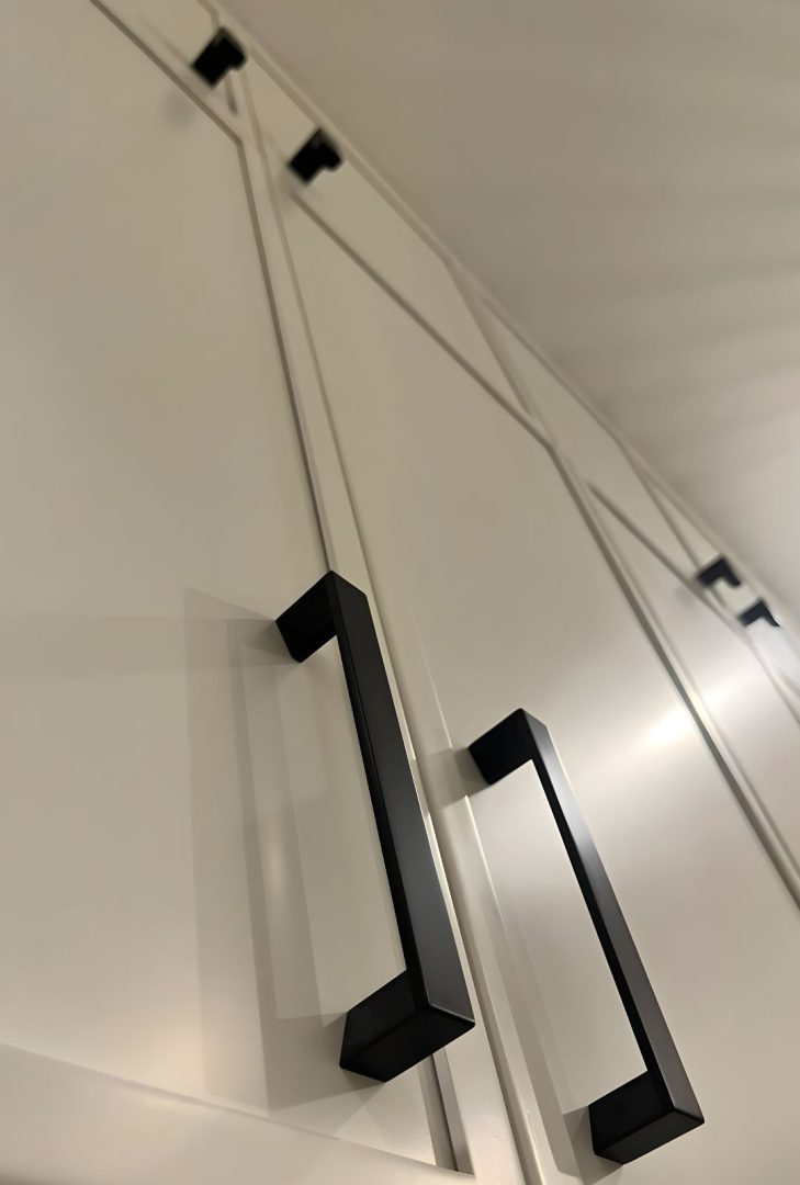 Emtek Trinity Collection door hardware featured in a Blackwell Homes show home. Showcasing clean lines and a modern design in finishes like Oil Rubbed Bronze, Polished Chrome, Satin Nickel, and Flat Black, these pieces add a touch of elegance and contemporary style to any home or office setting.