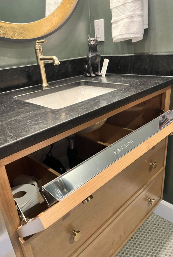 Rev-A-Shelf sink base organizers and false front tray products for maximizing kitchen storage, featuring pullout trays and tip-out organizers, available on hardwarehut.com