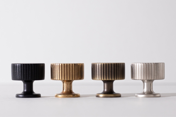 Armac Martin solid brass cabinet knobs shown in four premium finishes including matte black, brass, bronze, and satin nickel.